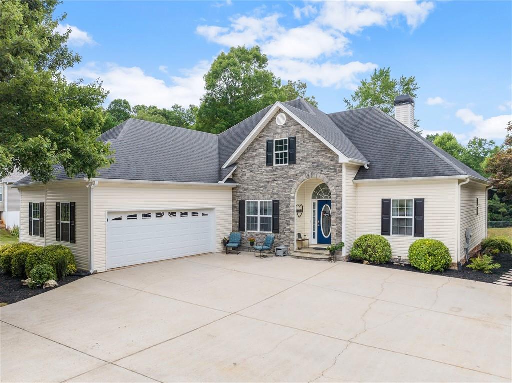 a front view of a house with garage