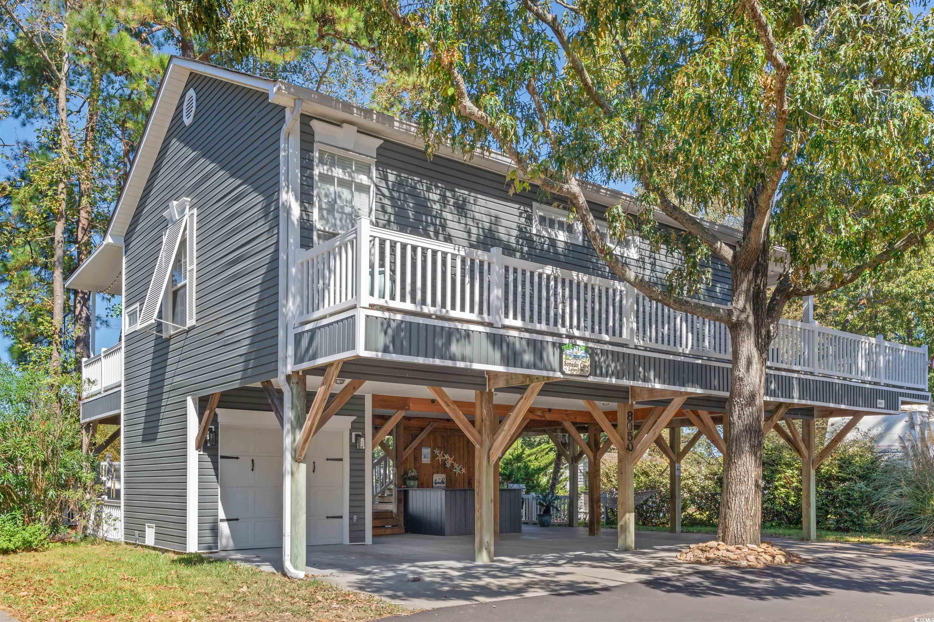 Exterior space with a carport and a garage