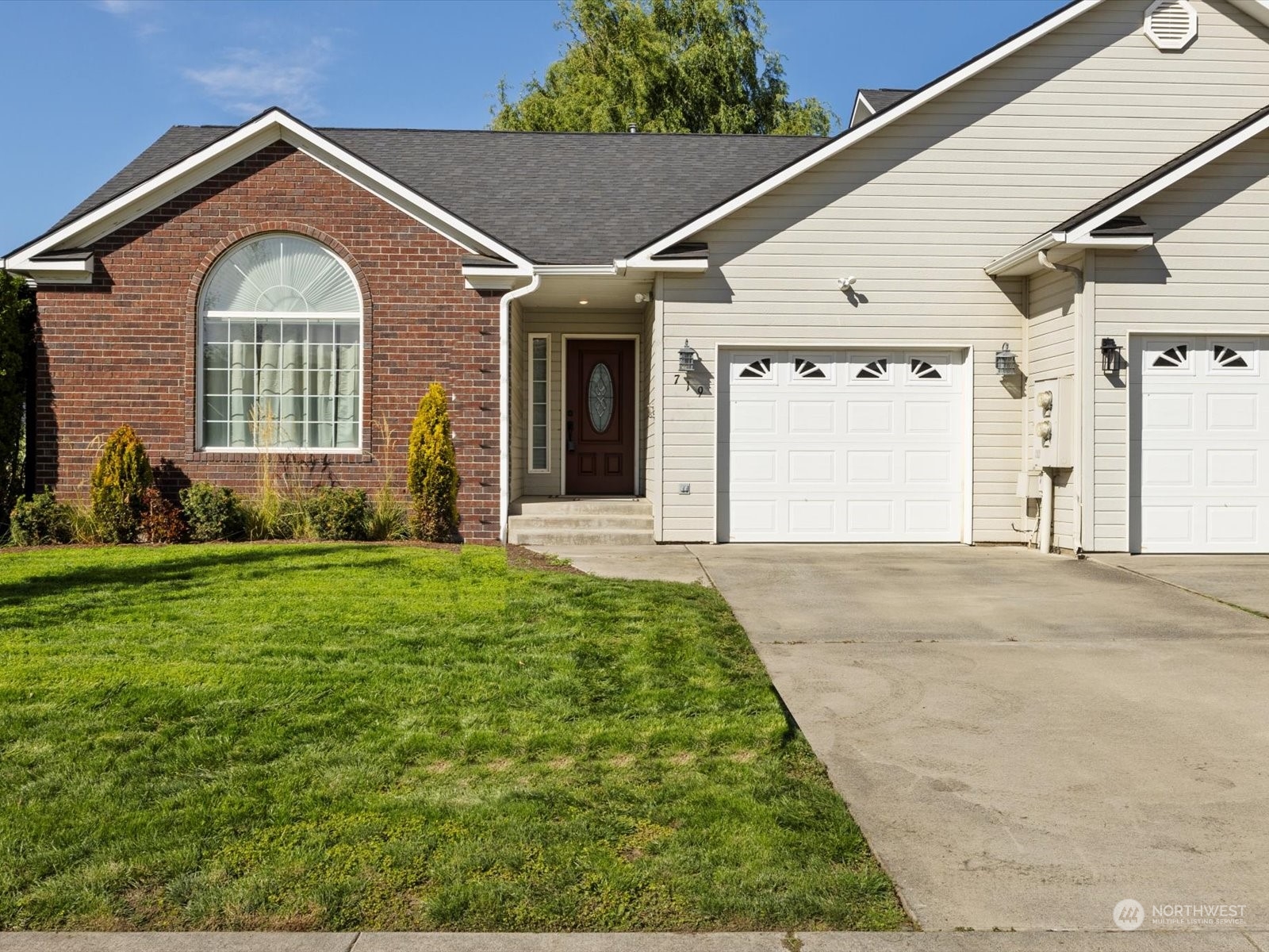 a front view of a house with garden