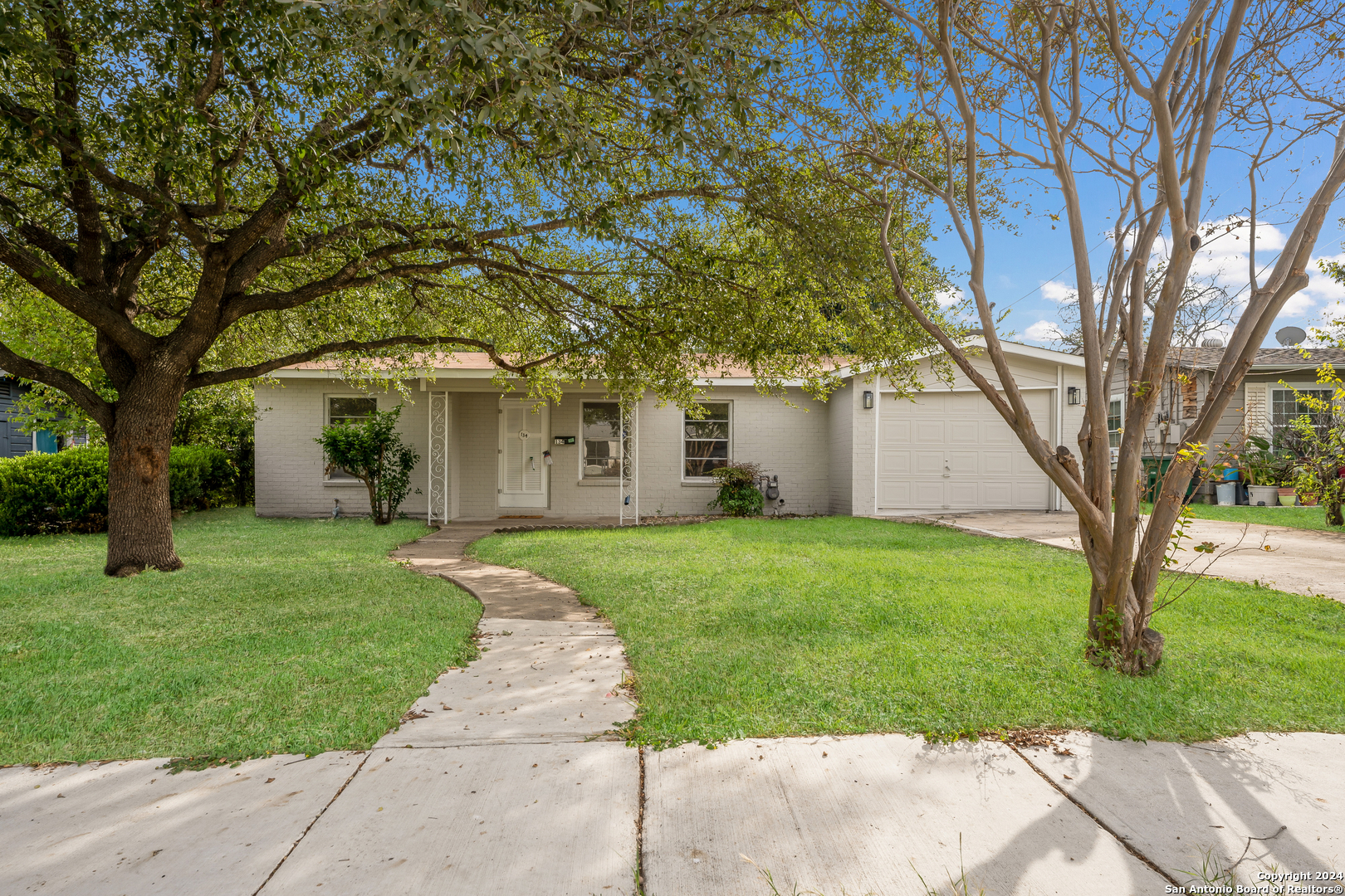 front view of a house with a yard