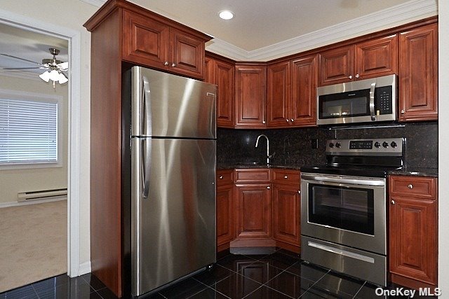 a kitchen with stainless steel appliances granite countertop a refrigerator stove and microwave