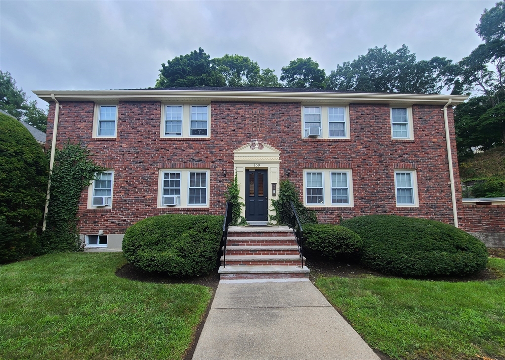 a front view of a house with yard