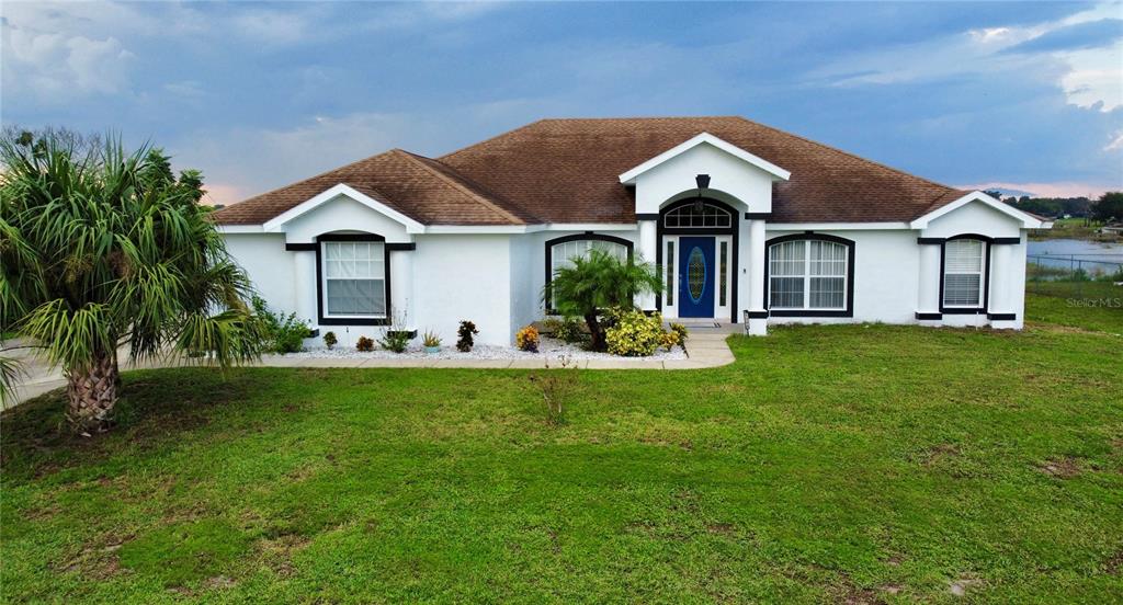 a front view of a house with a yard