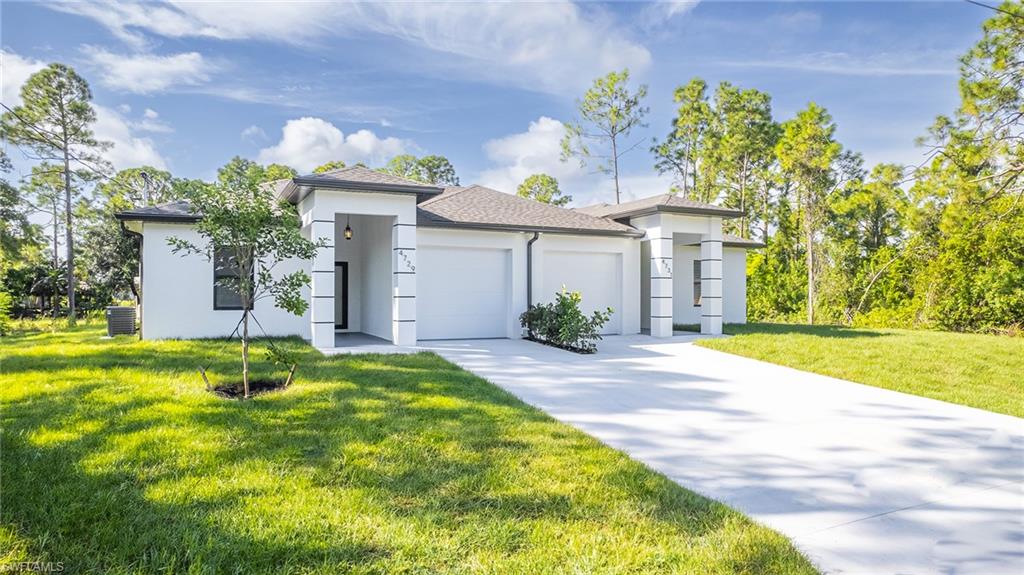 a front view of house with yard and green space