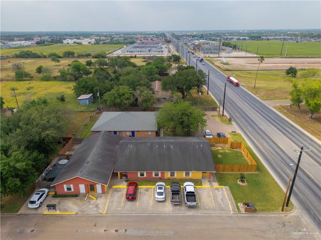 an aerial view of residential houses with outdoor space and swimming pool