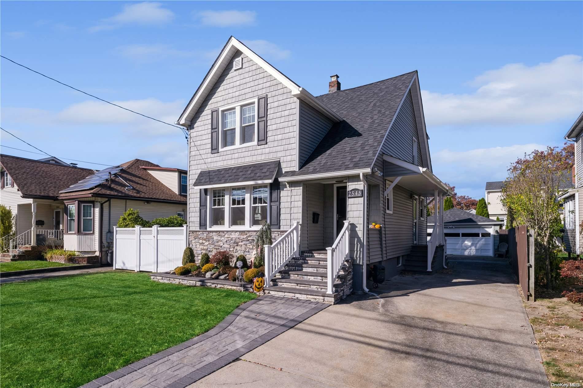 a view of a house with a yard and plants