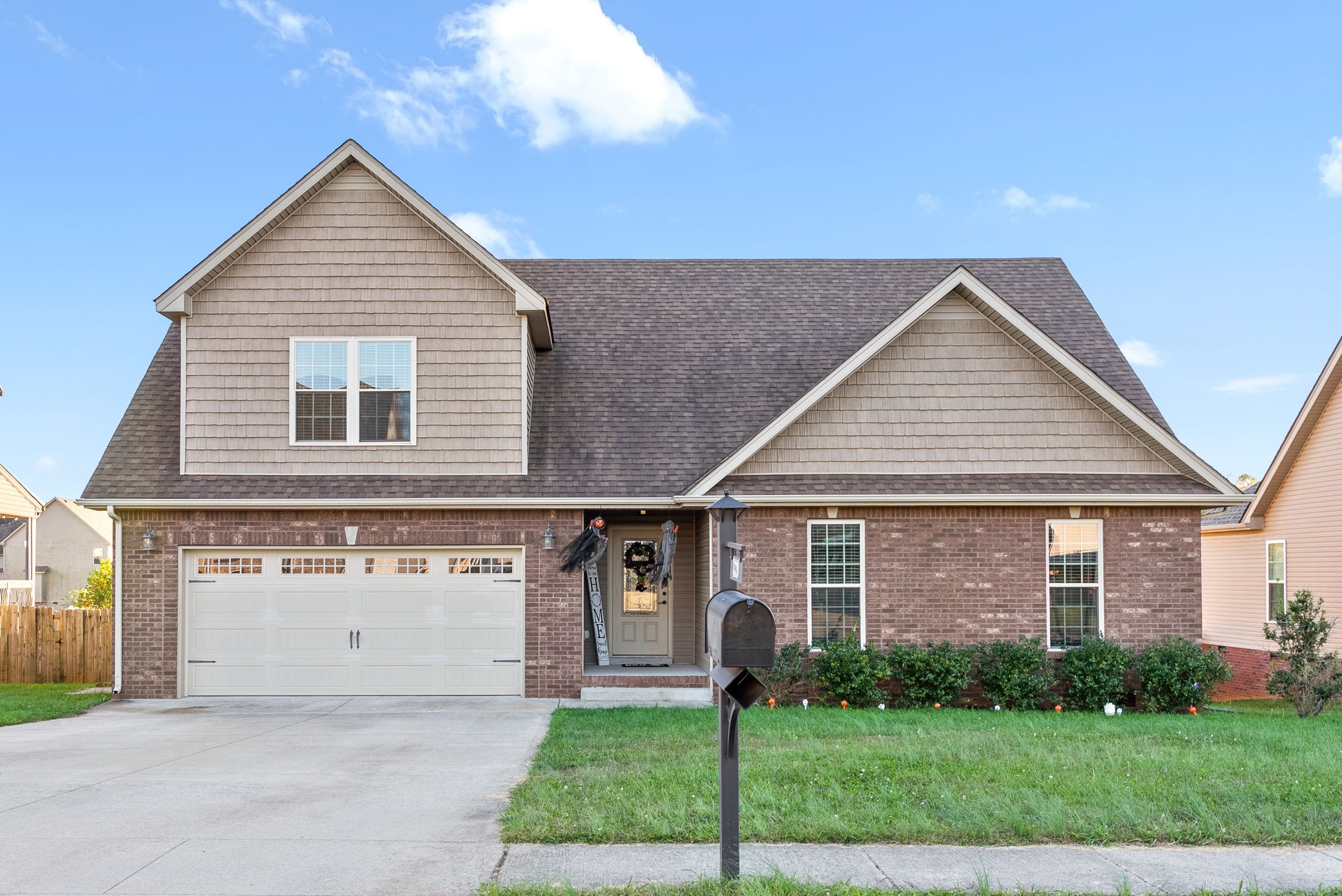 front view of a house with a yard