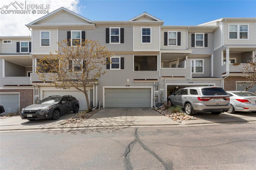 View of property featuring a garage