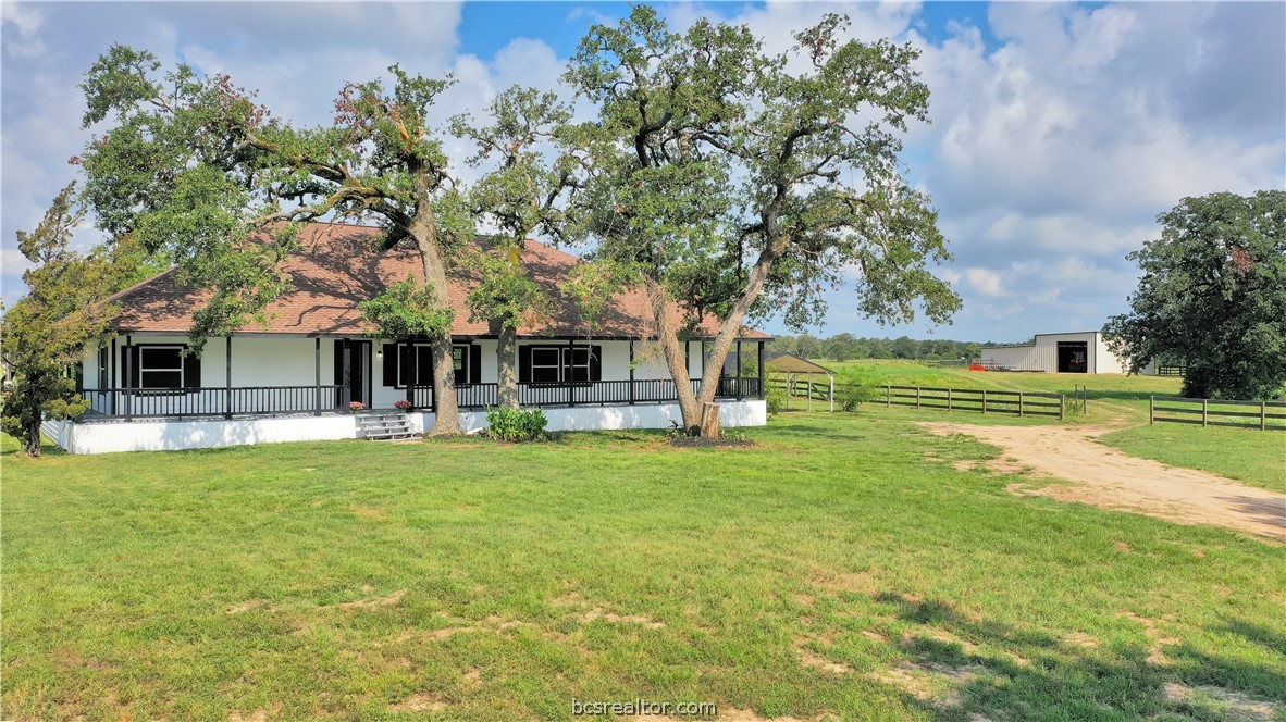 a view of a house with a big yard