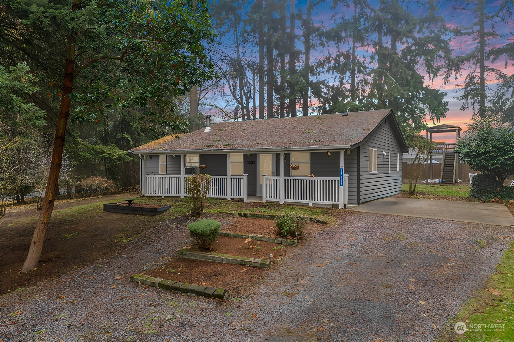 a front view of a house with a garden