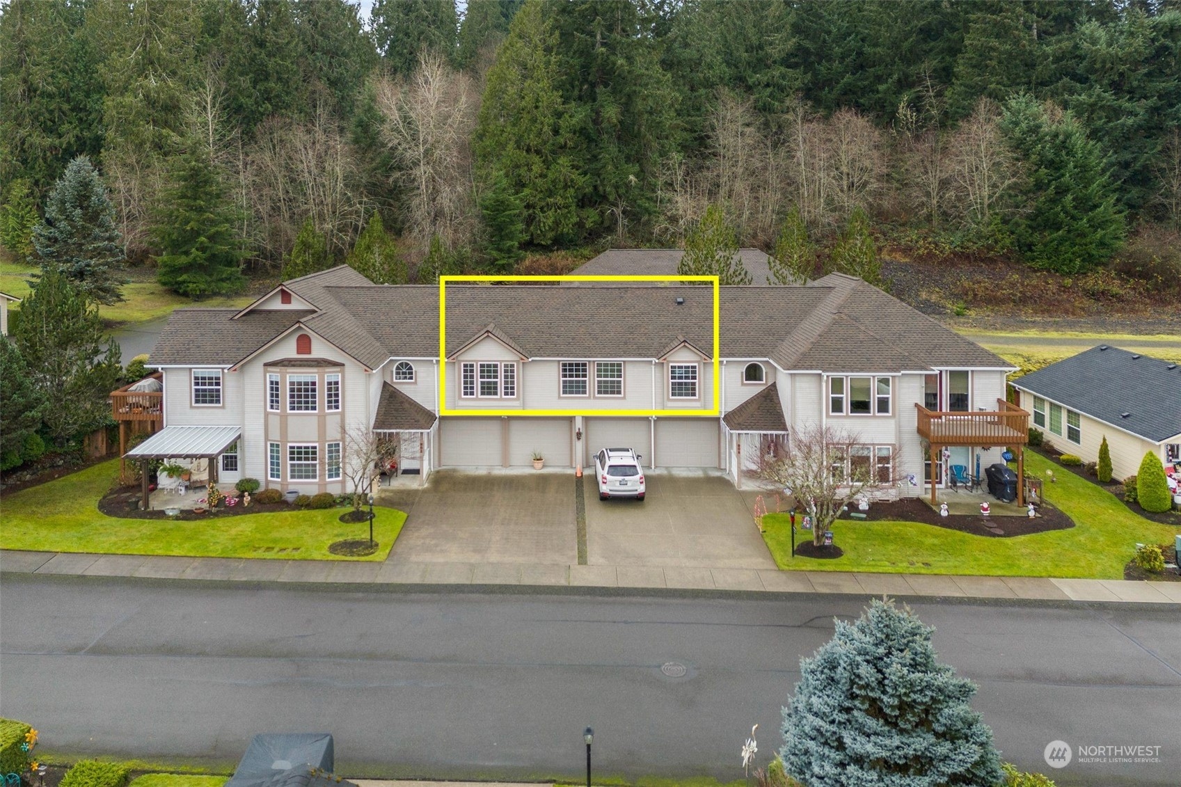 an aerial view of a house with swimming pool and big yard