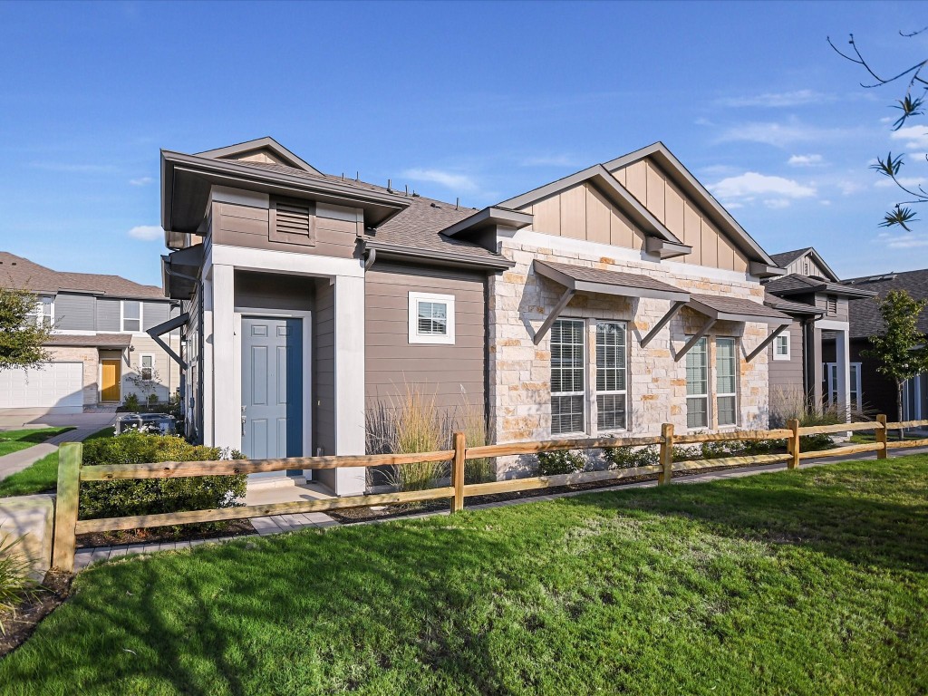 front view of a house with a yard