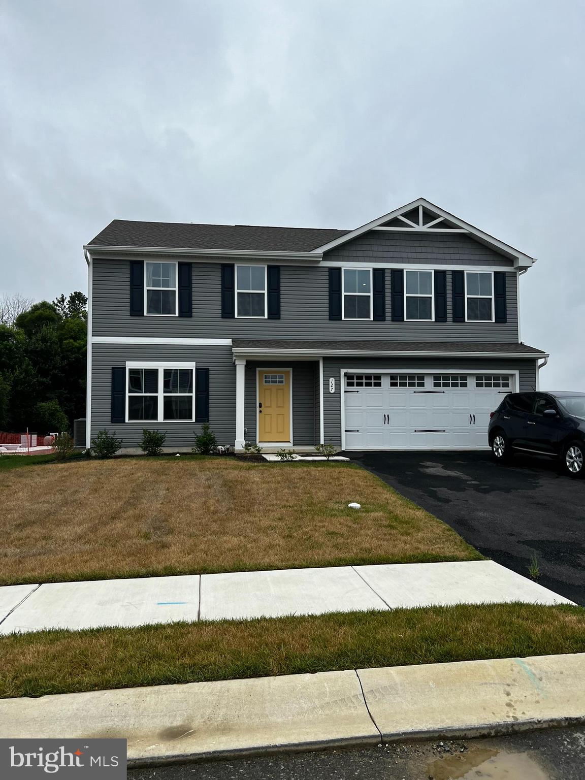 a front view of a house with a yard