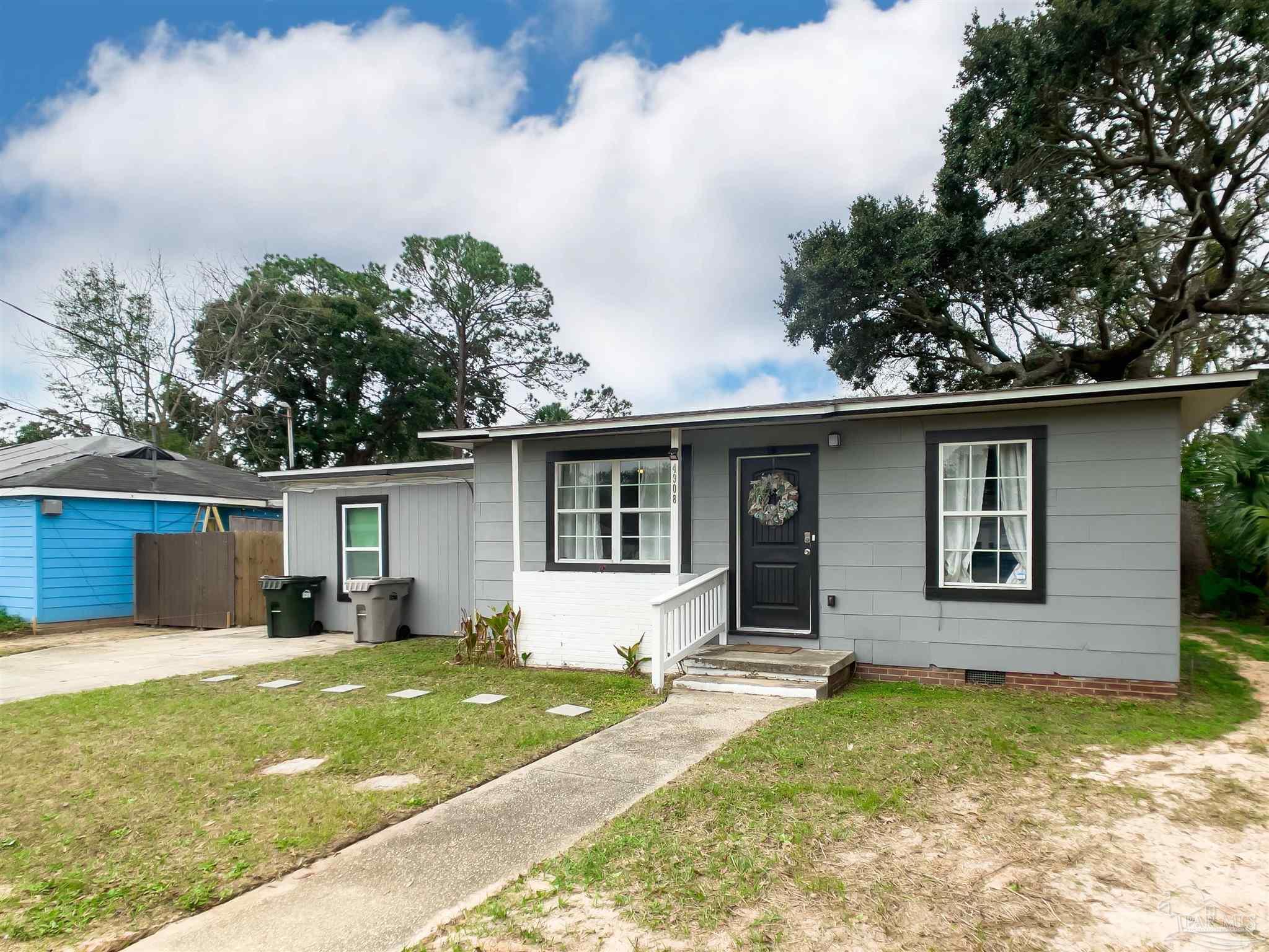 a view of a house with a yard