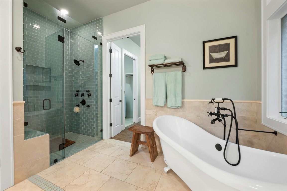 a bathroom with a tub and shower