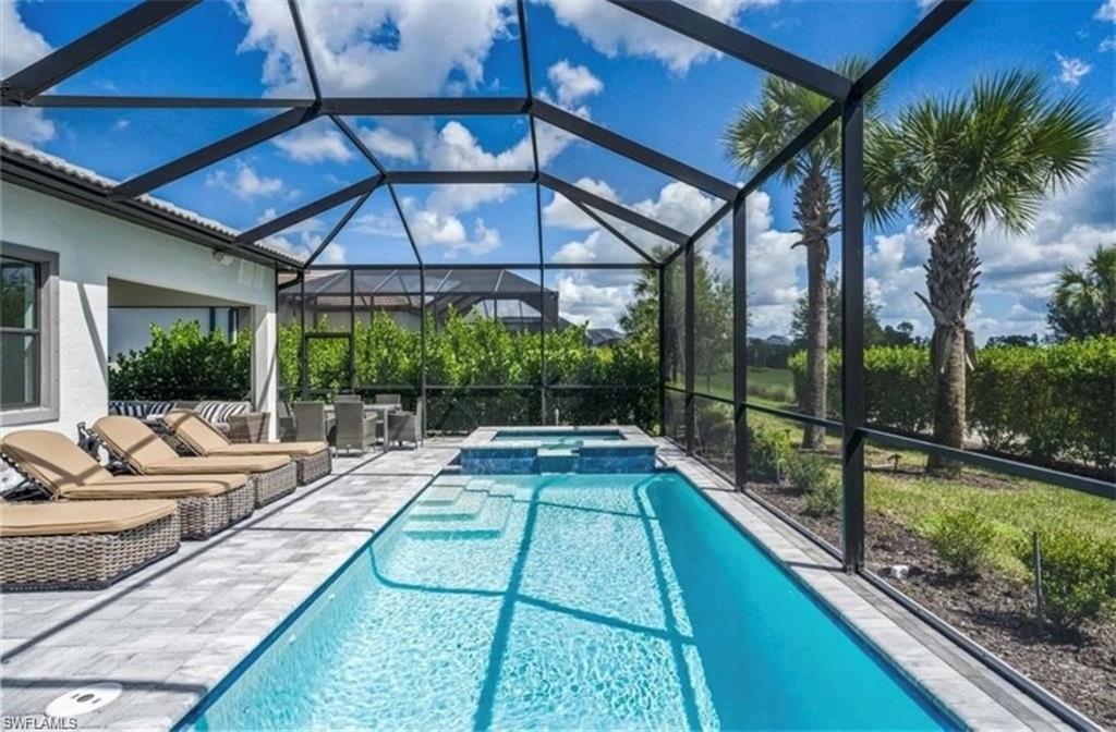 a view of swimming pool with a patio