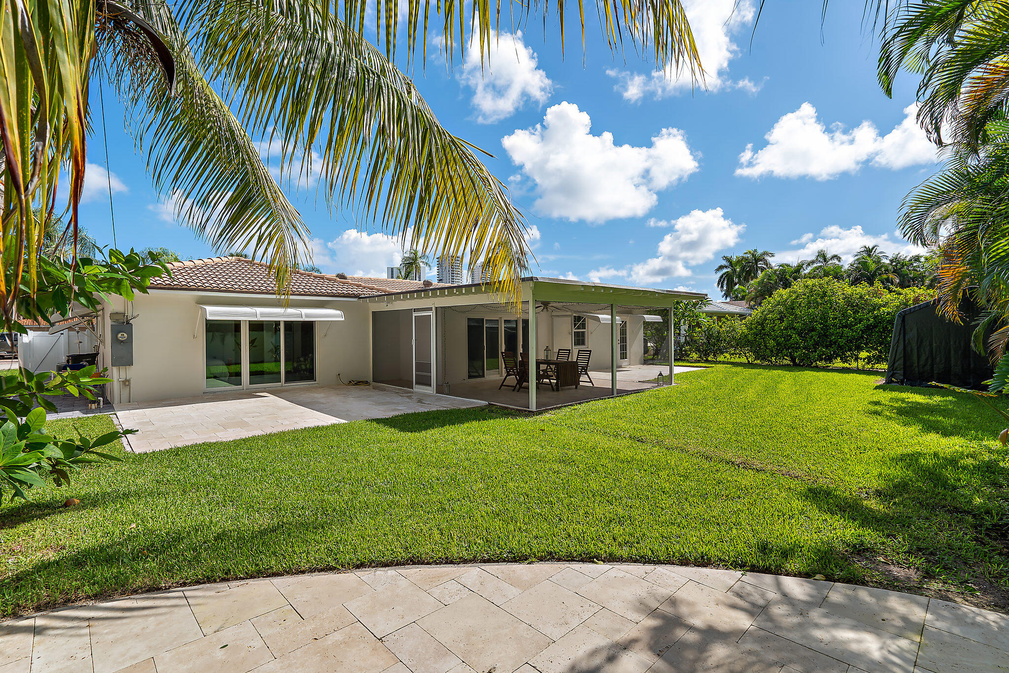 a front view of a house with garden and porch