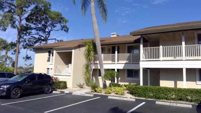 a view of a car park front of house