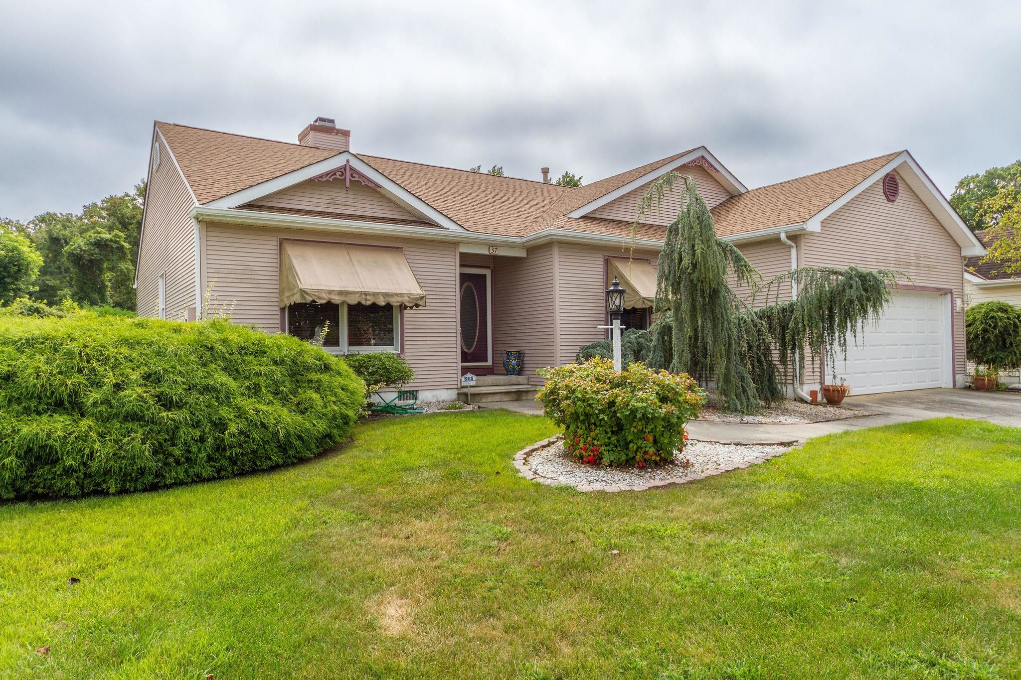 a front view of a house with a yard