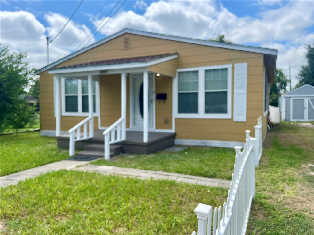 front view of a house with a yard