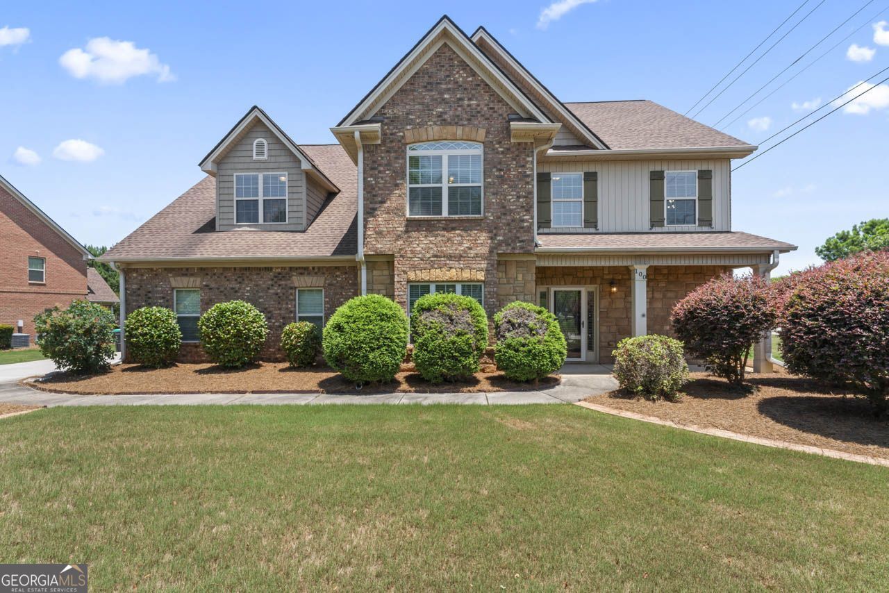 a front view of a house with a yard