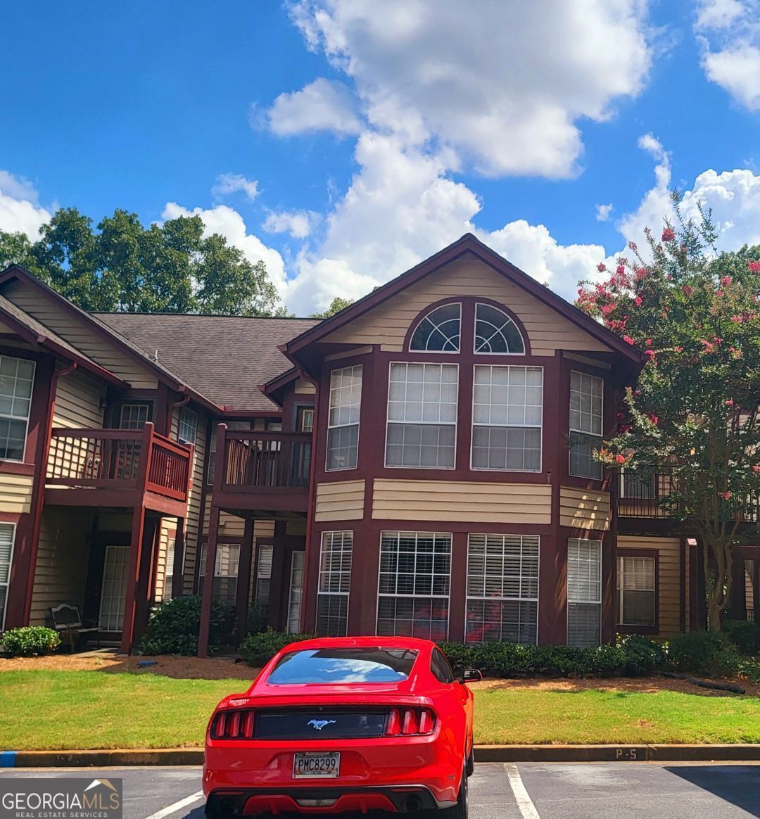 a front view of a house with swimming pool