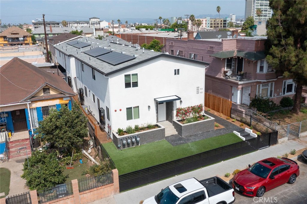 an aerial view of a house with outdoor space