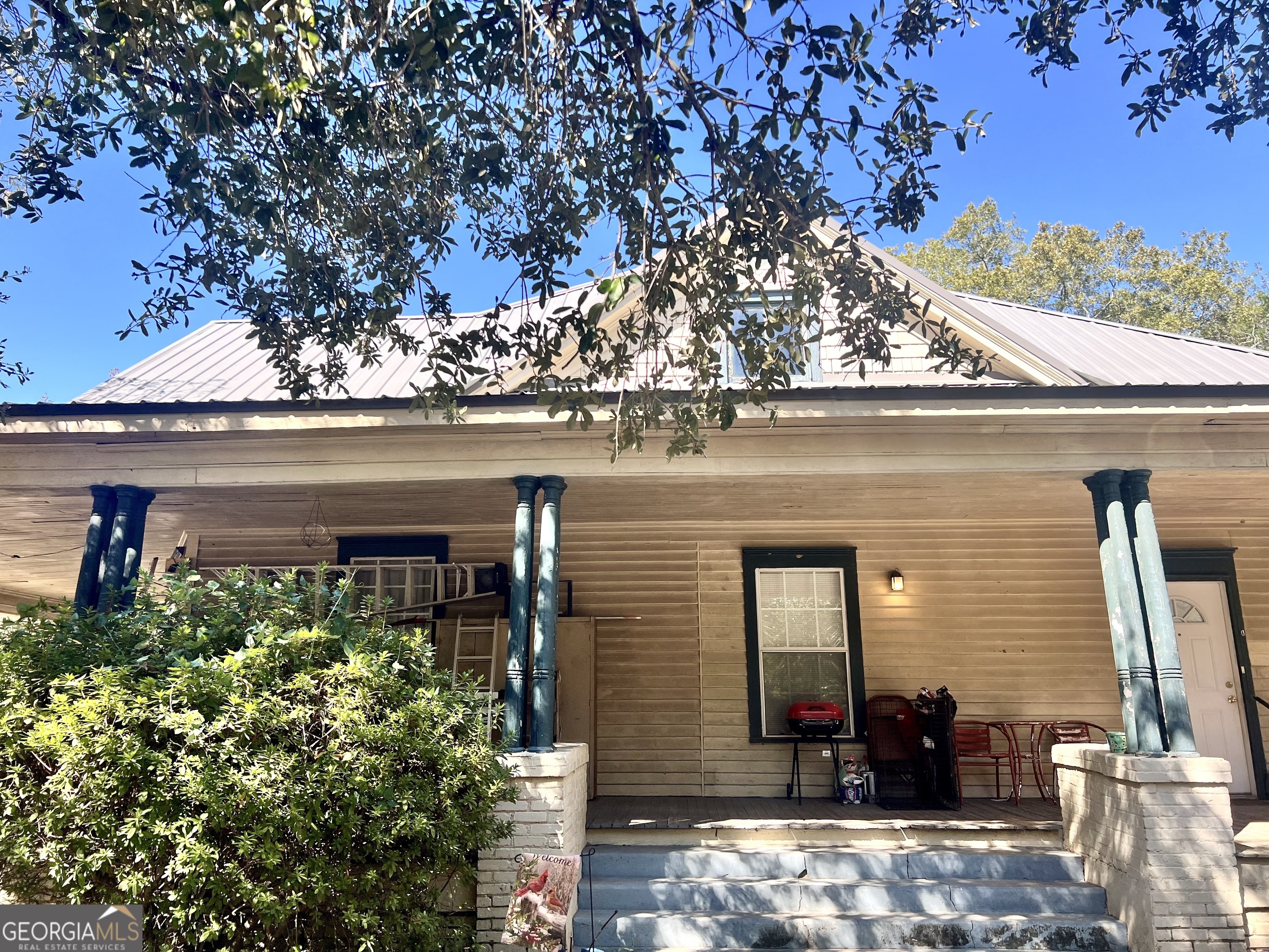 a front view of a house with garden