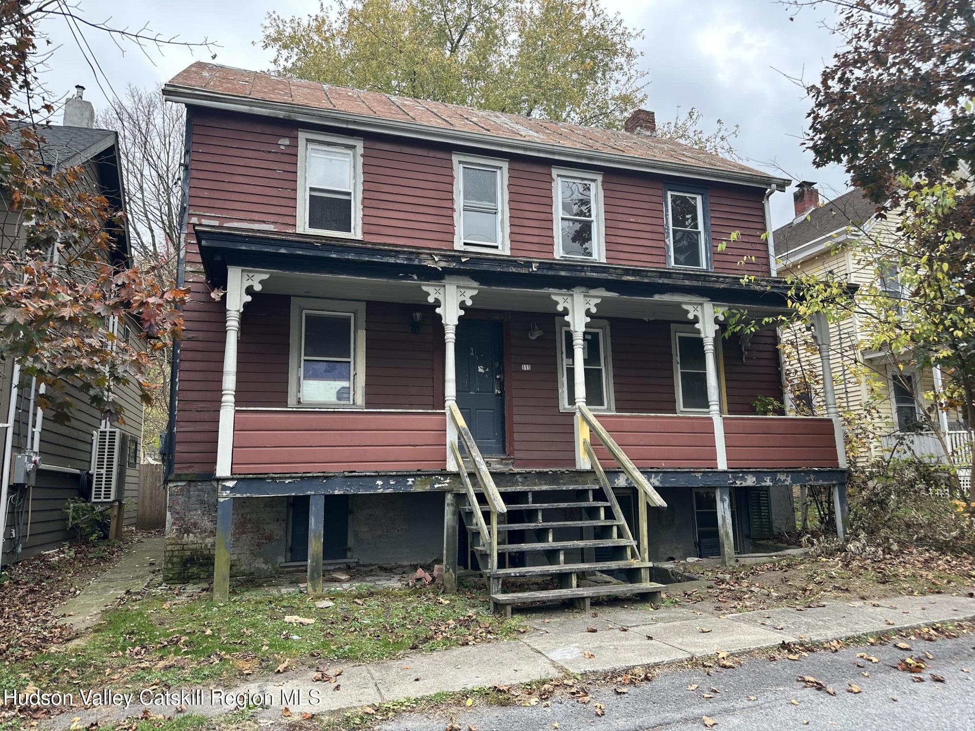 a front view of a house with a porch