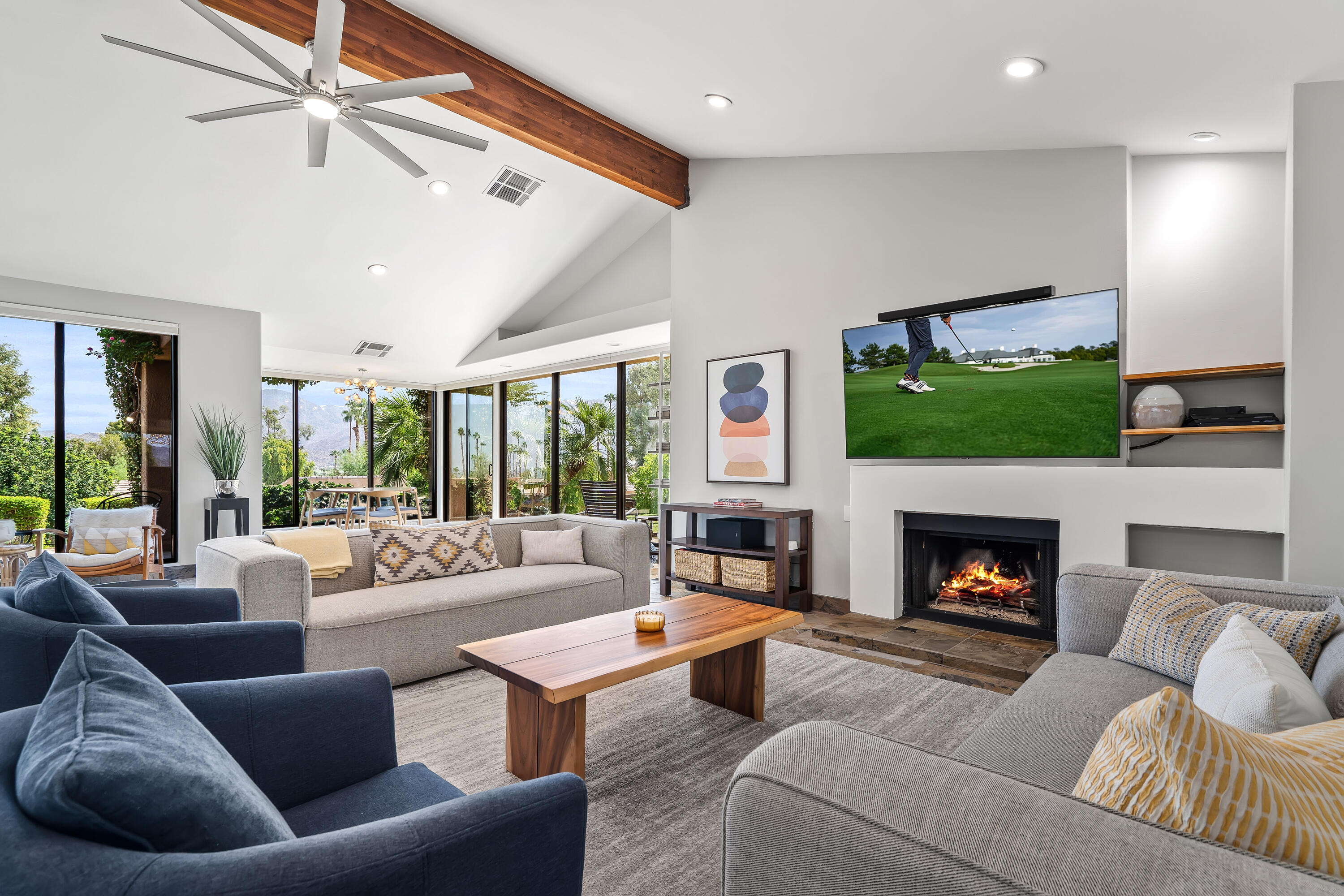 a living room with furniture fireplace and window