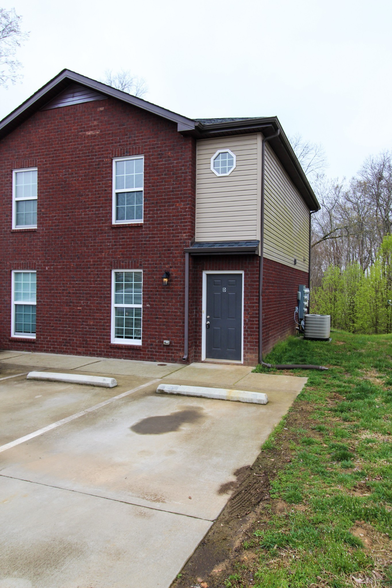 a brick house with a large windows