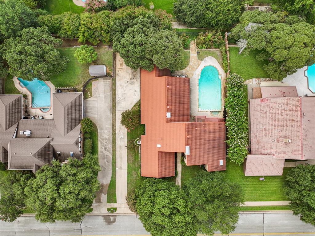 an aerial view of a house with a garden