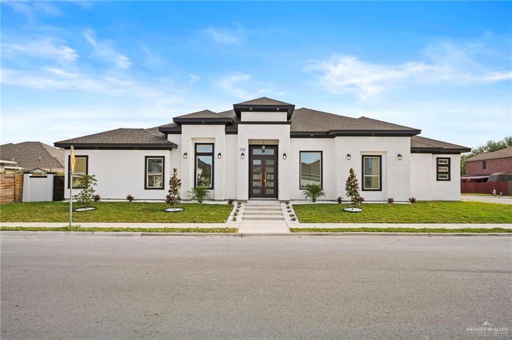 front view of a house with a yard