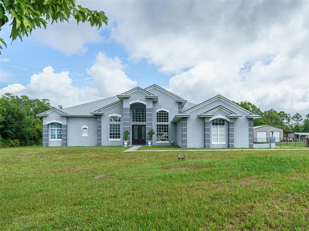 a front view of a house with a yard