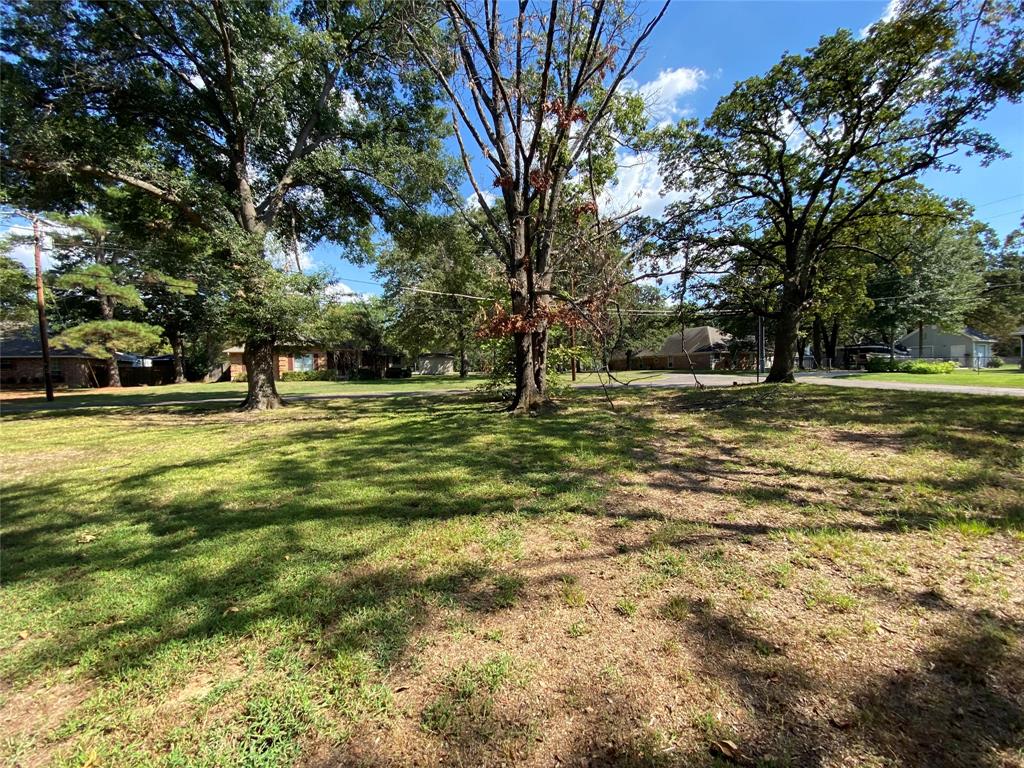 a large building with trees in the background