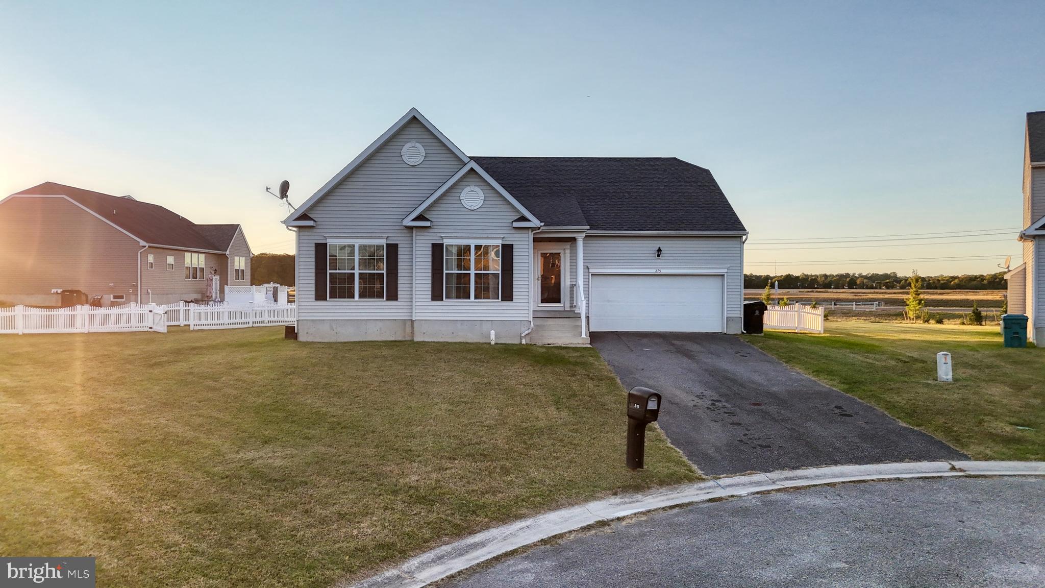 a front view of a house with swimming pool and porch