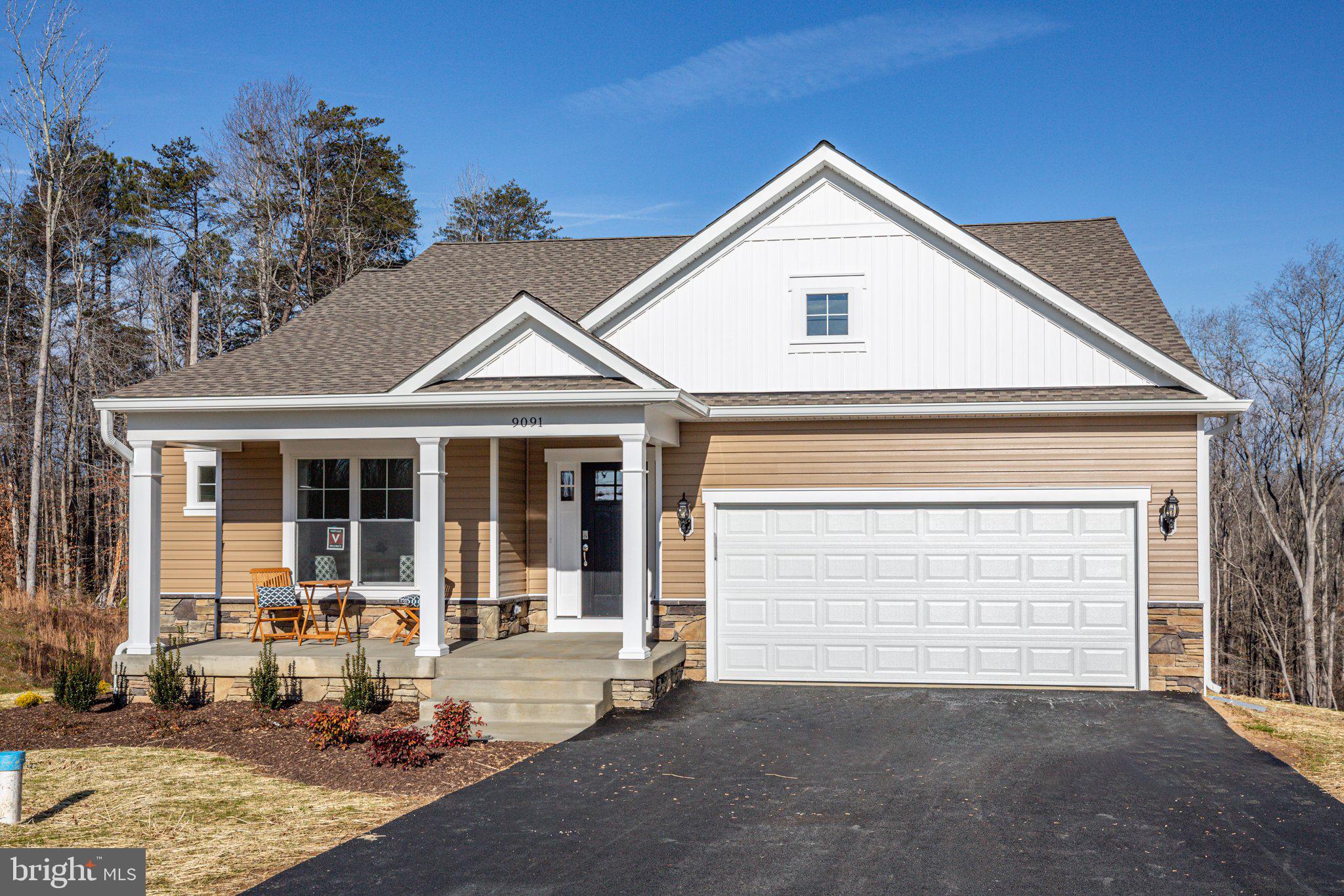 a front view of a house with a garage