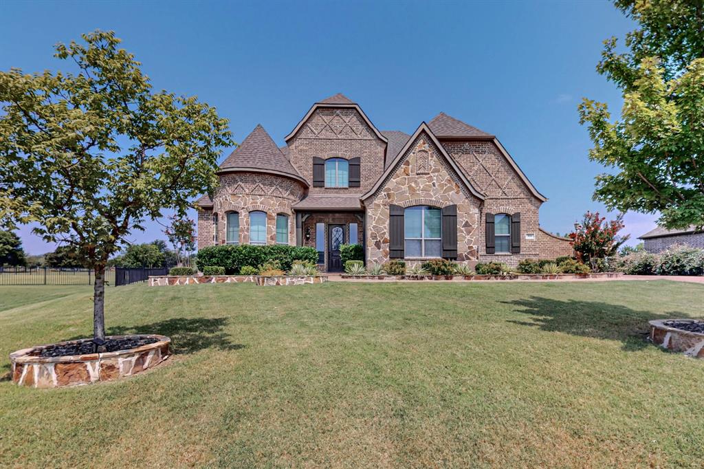 front view of a house with a yard