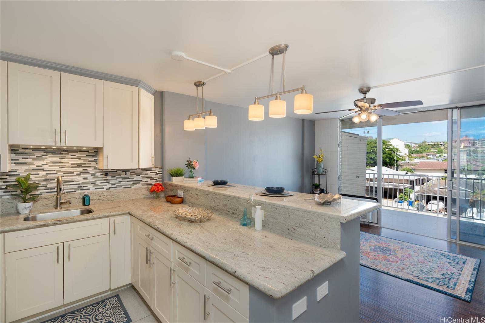 a kitchen with a sink a counter space and appliances