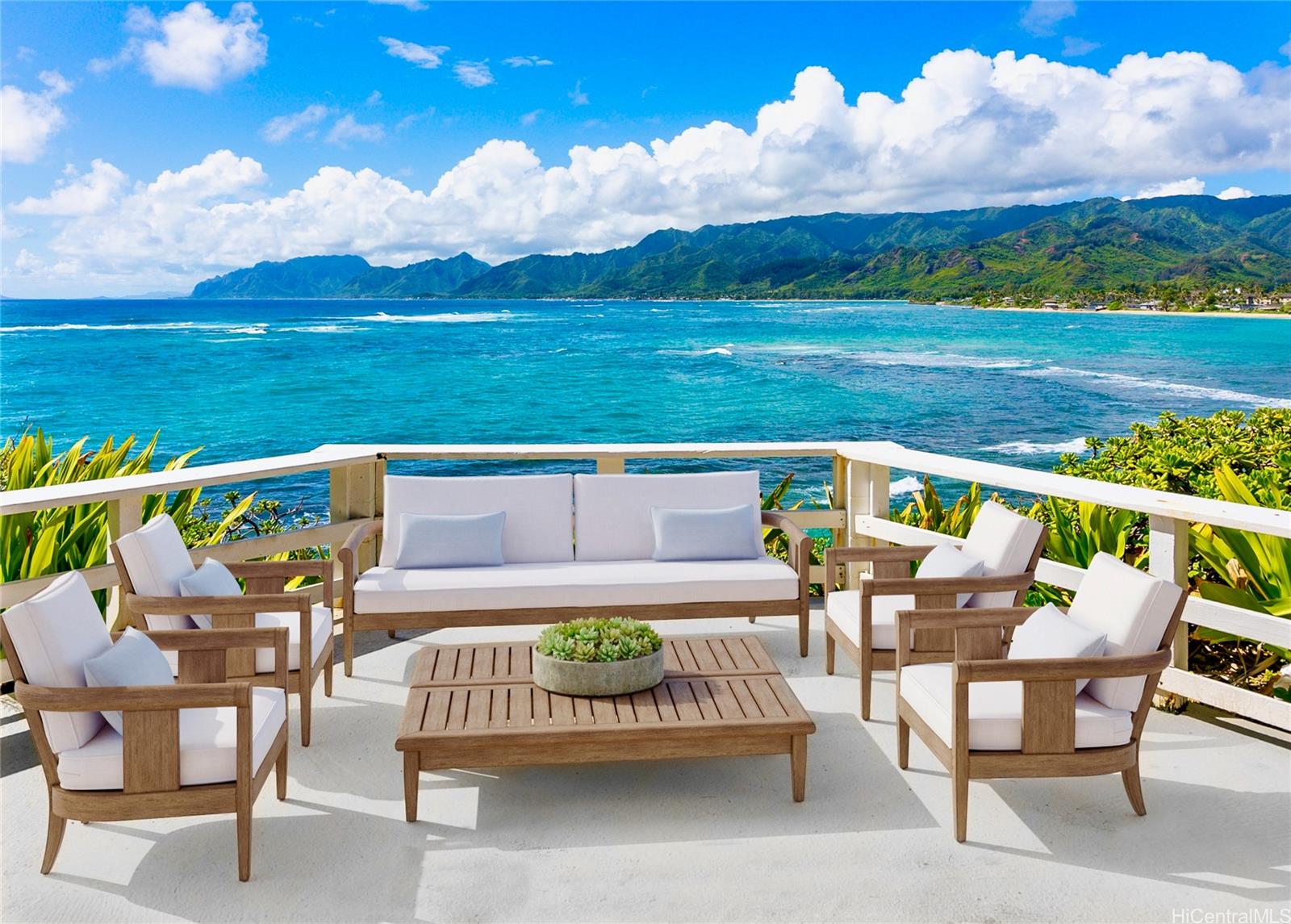 a view of an outdoor sitting area with furniture and garden