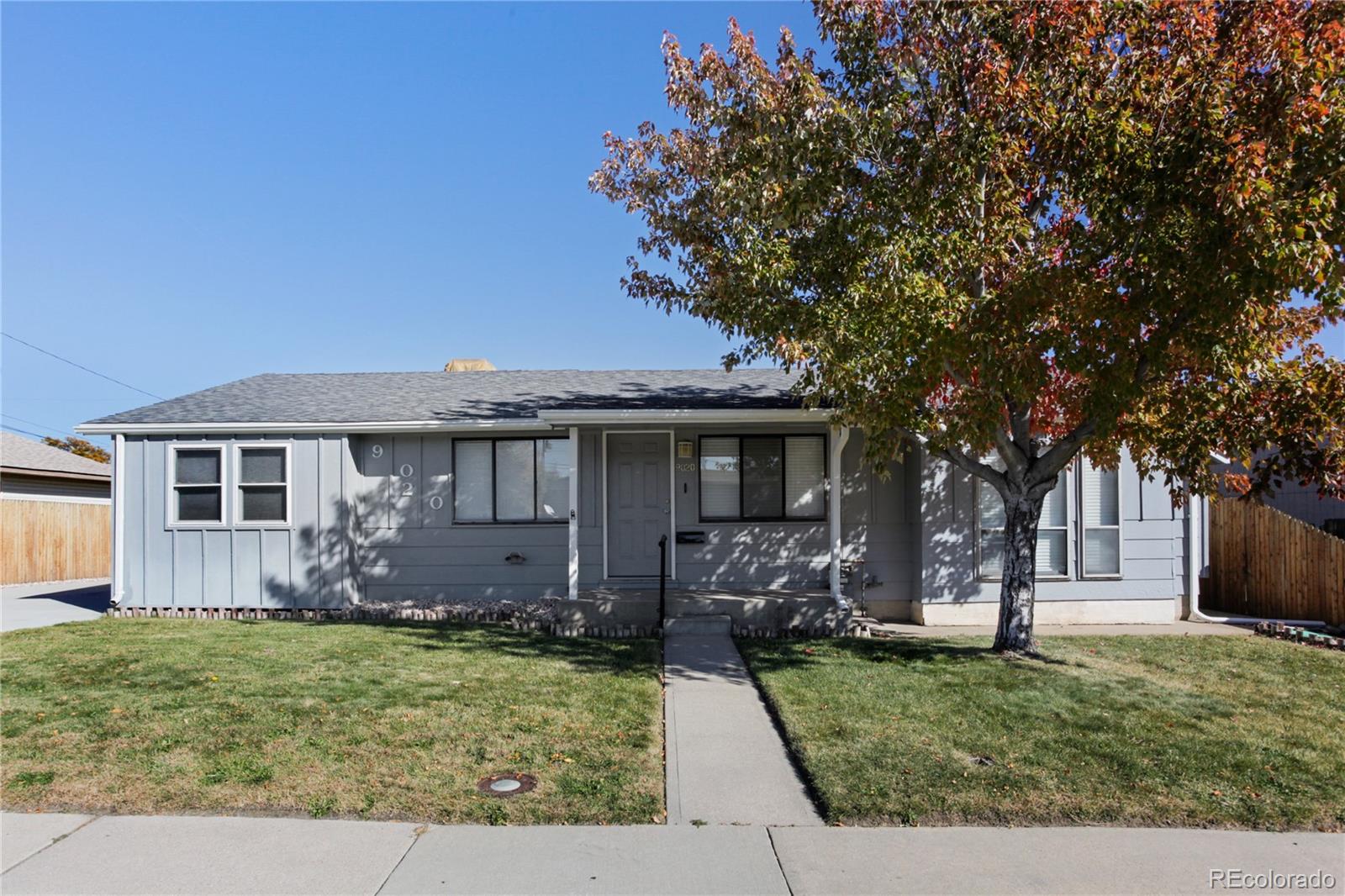 front view of a house with a yard