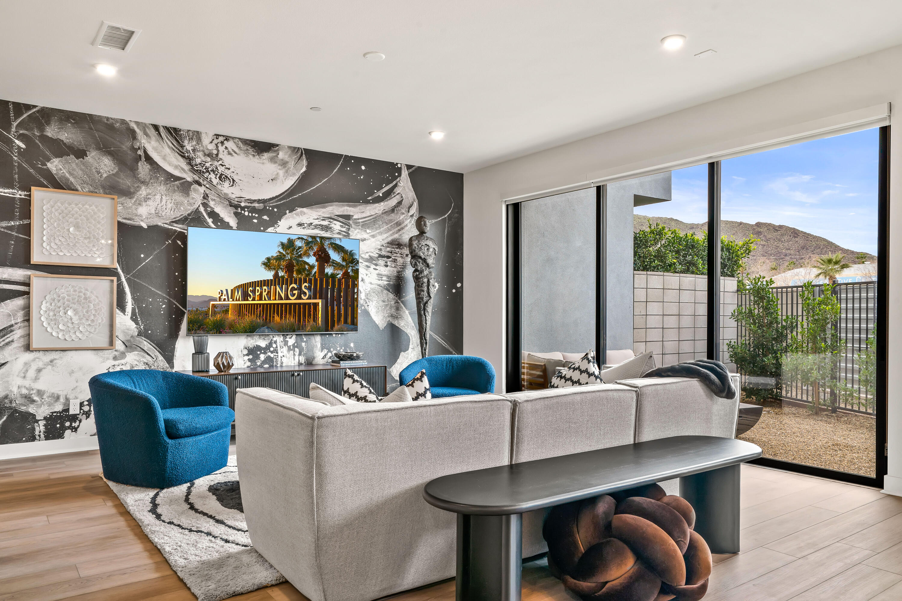 a living room with furniture and a large window