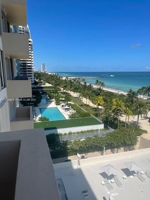 a view of a street with an ocean view