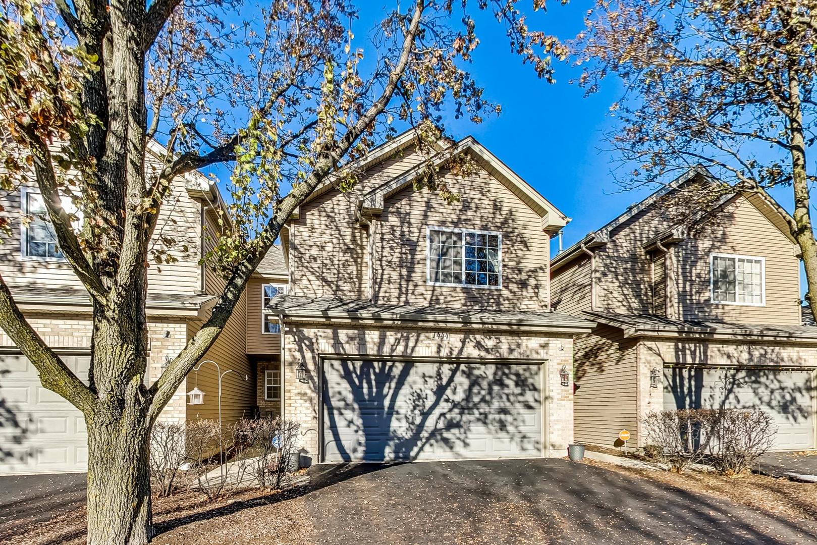 a view of a house with large trees