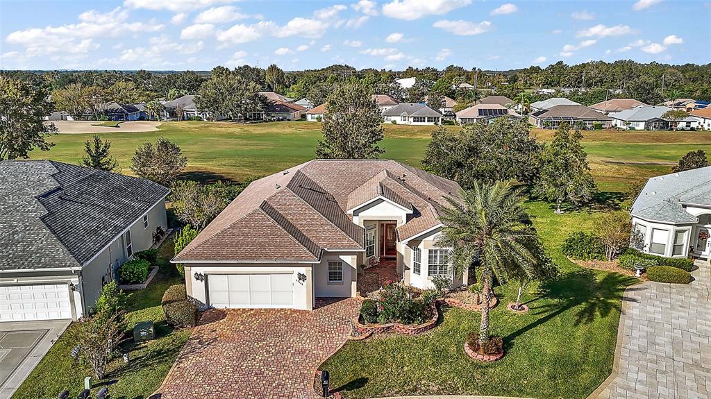 an aerial view of a house with a lake view