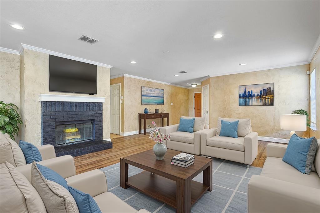 a living room with furniture fireplace and flat screen tv