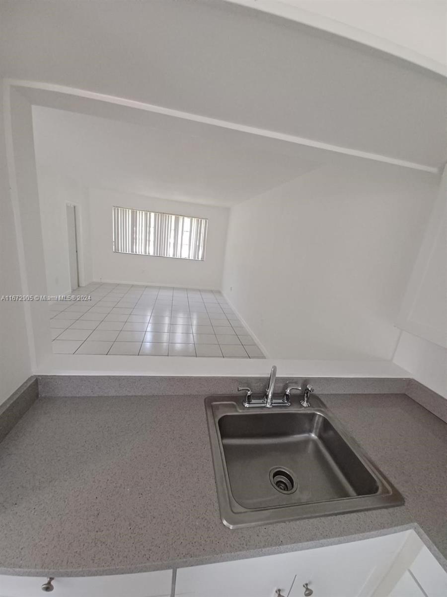 a bathroom with a sink and vanity