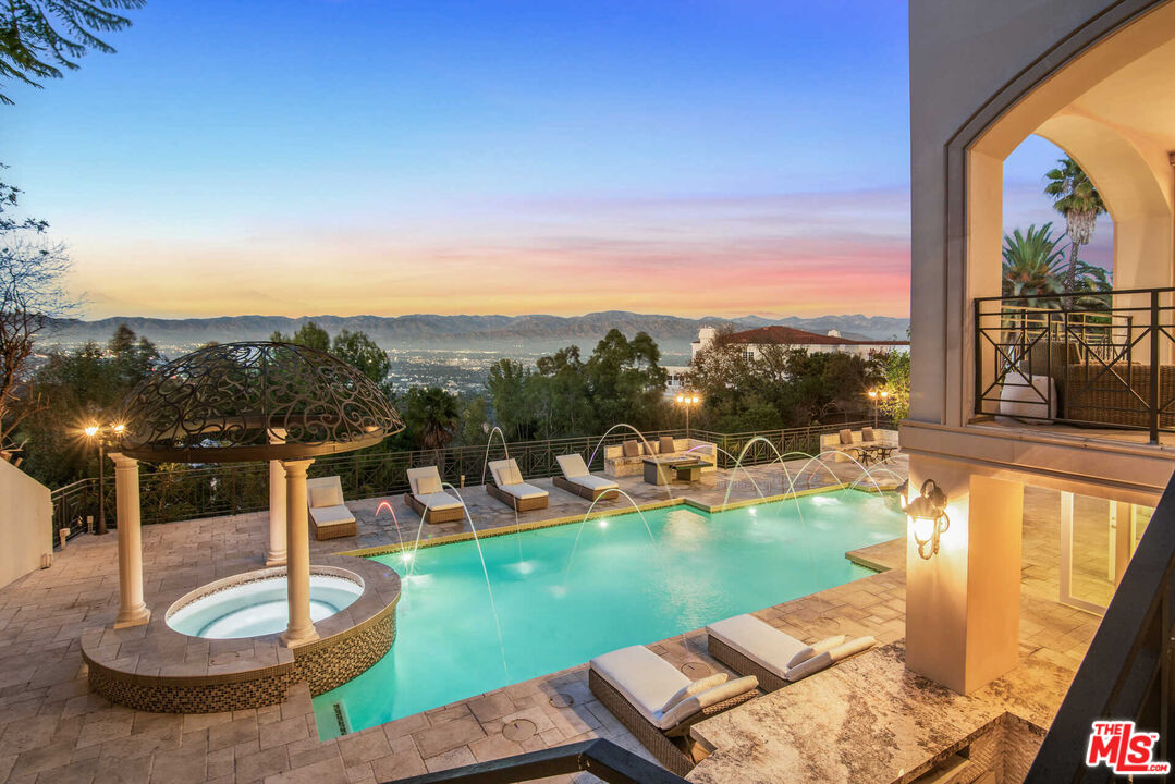 a view of a swimming pool with a patio