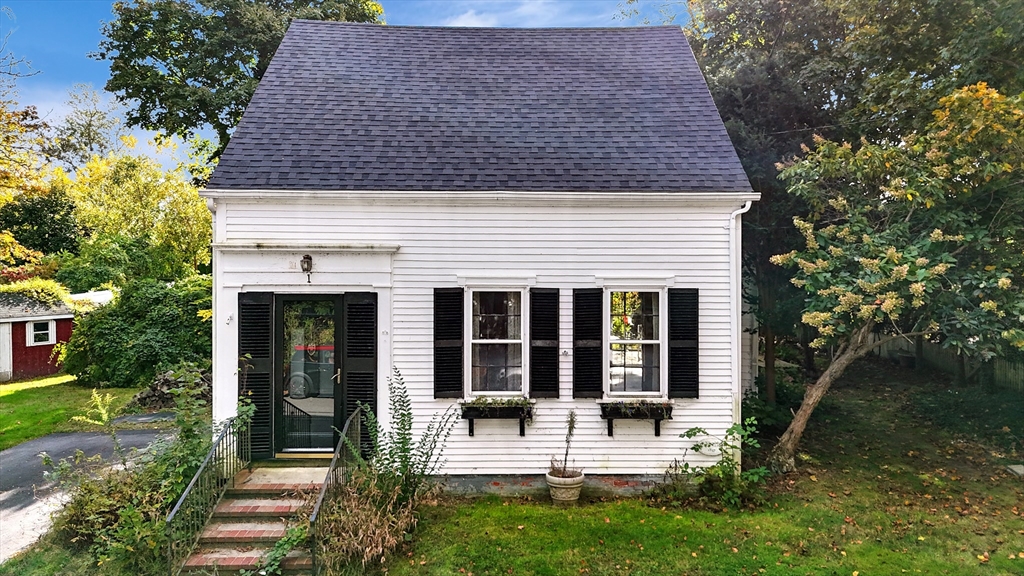 front view of a house with a yard