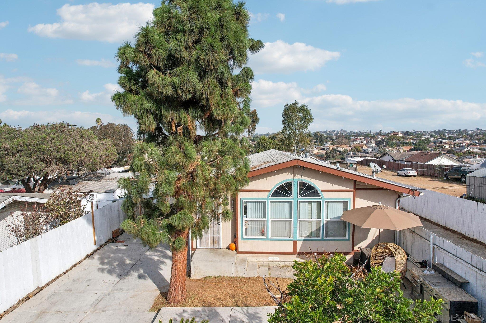 an aerial view of houses with trees